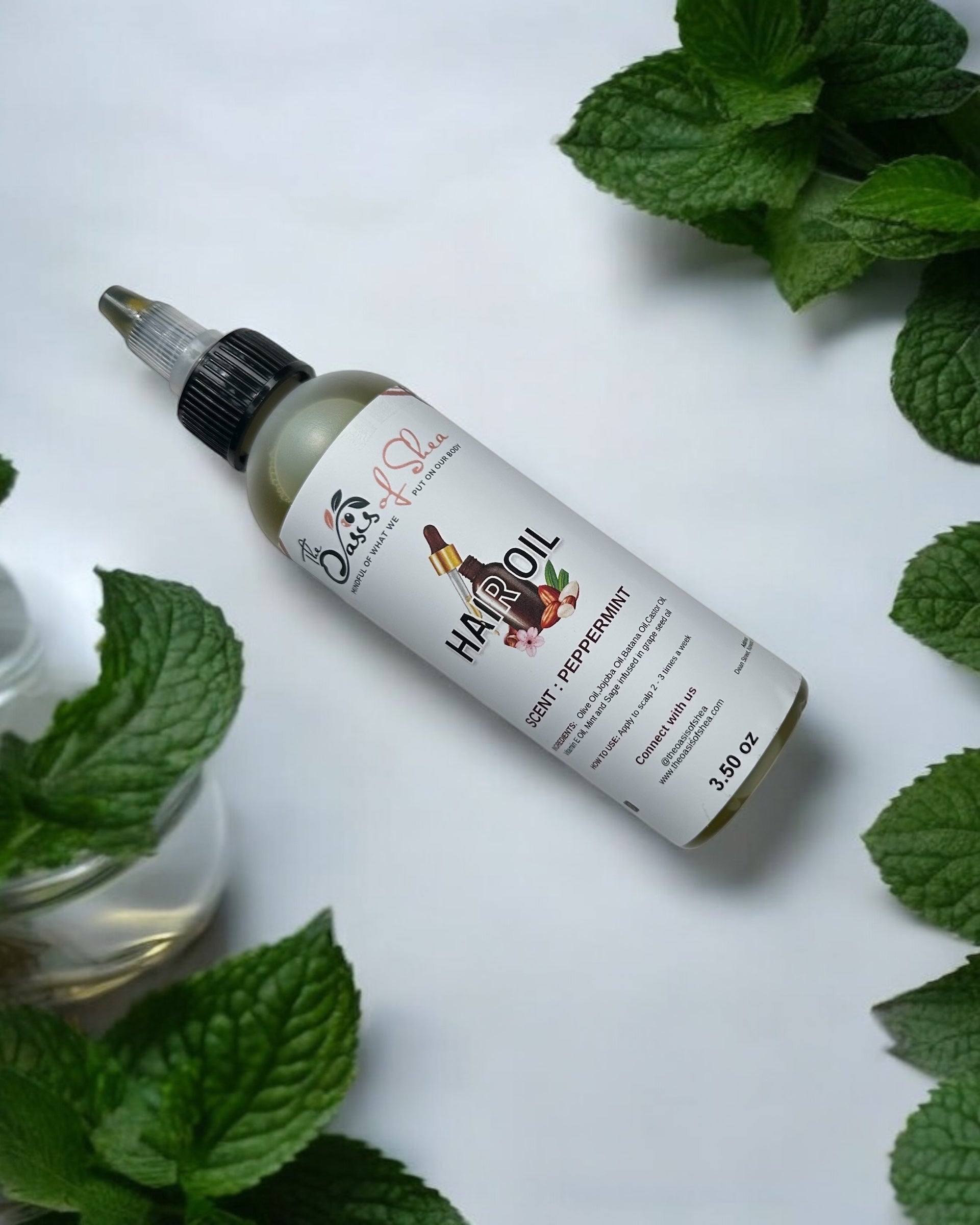 Peppermint Hair Oil in a clear plastic bottle – infused with mint and sage for soothing scalp care and healthy hair